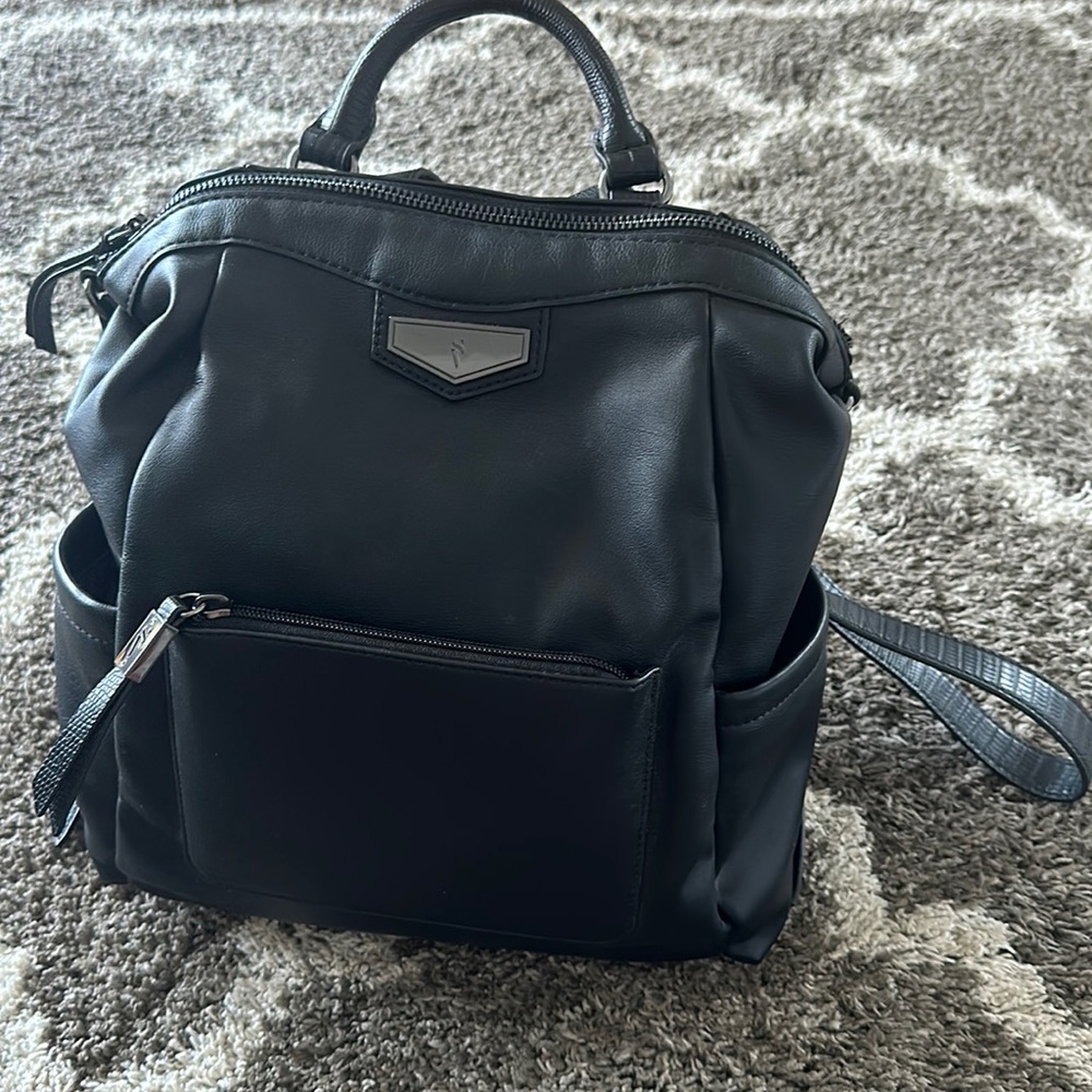 Small black leather backpack. Never used.